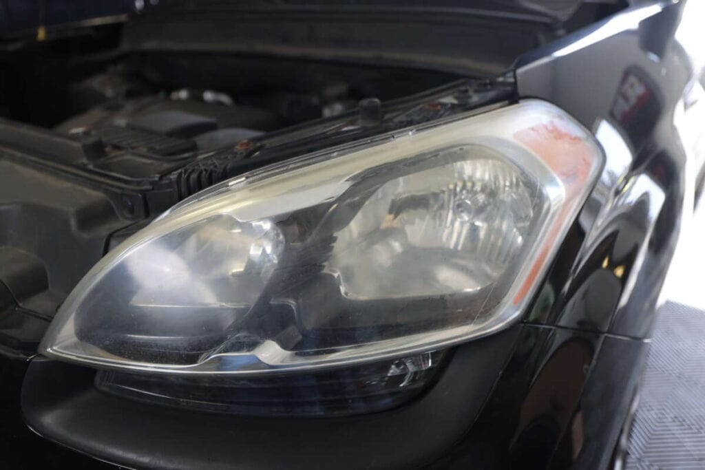 Picture of headlight before it's been repaired with headlight renewal.