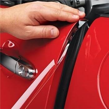 A hand is checking the alignment of a red car door near the handle and rubber seal, crucial steps emphasized in Paint Protection Film Training.