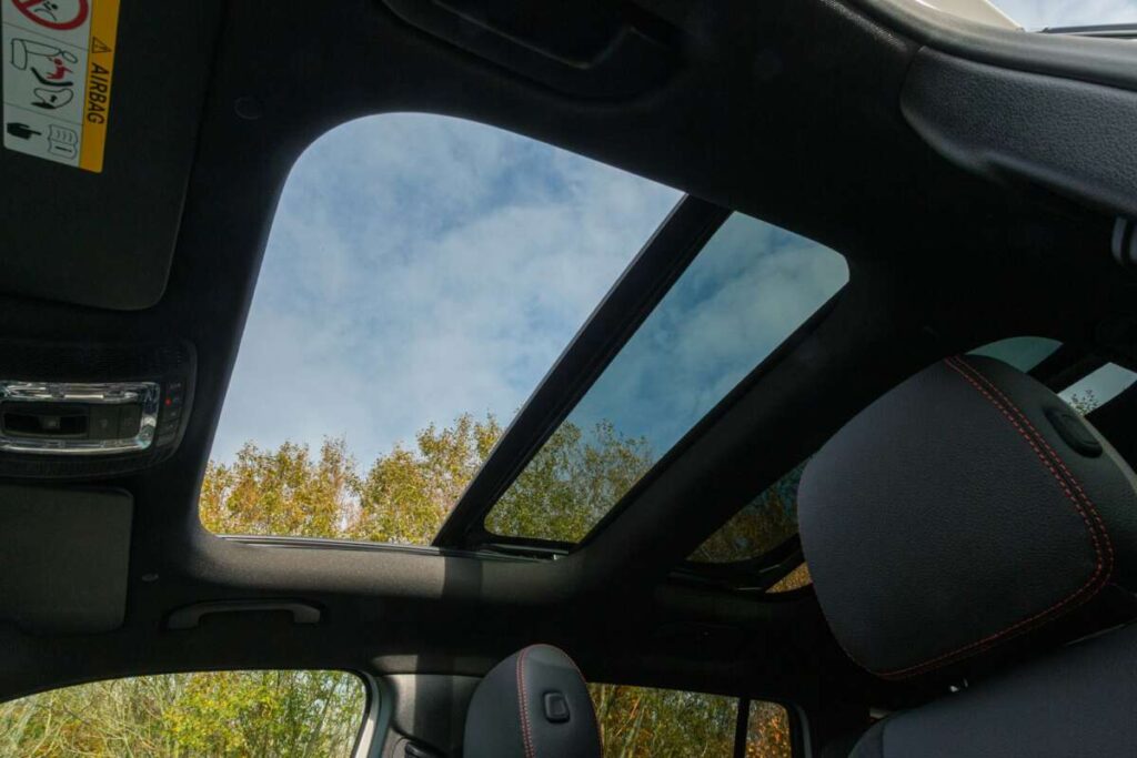 Closeup shot of open hatch detail on a roof of the modern car